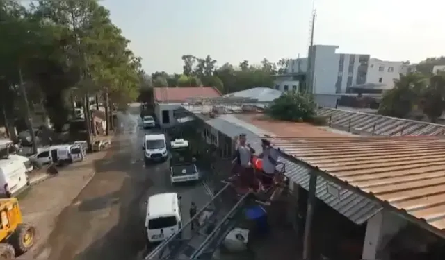 Patrondan Çatıda Güneş Altında Çalışan İşçilere Dronla Soğuk İçecek Servisi